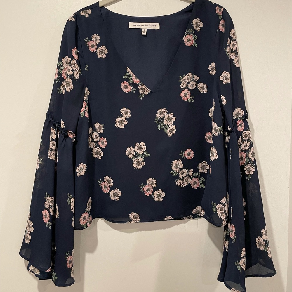 Floral blouse with flare sleeves, fully lined.